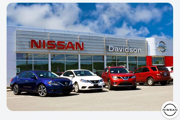 Davidson Nissan Dealership In Watertown NY Building Exterior With Nissan Car Lineup